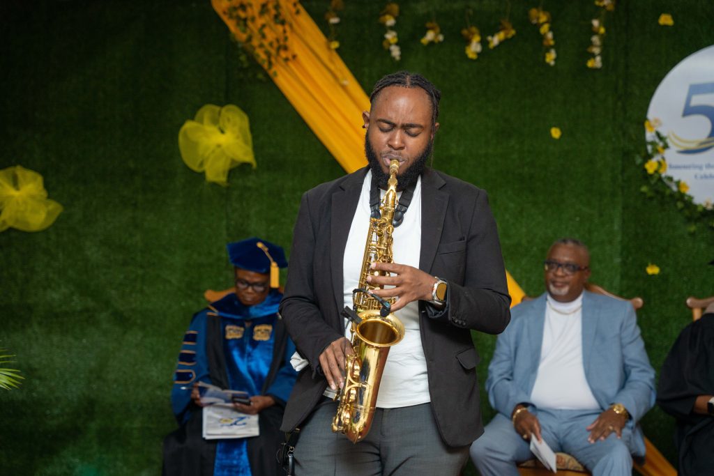 A saxophonist performing during a BTCC graduation celebration